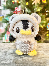 Load image into Gallery viewer, Northern Lights the Penguin in a Polar Bear Onesie