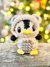 Load image into Gallery viewer, Northern Lights the Penguin in a Polar Bear Onesie