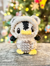 Load image into Gallery viewer, Northern Lights the Penguin in a Polar Bear Onesie
